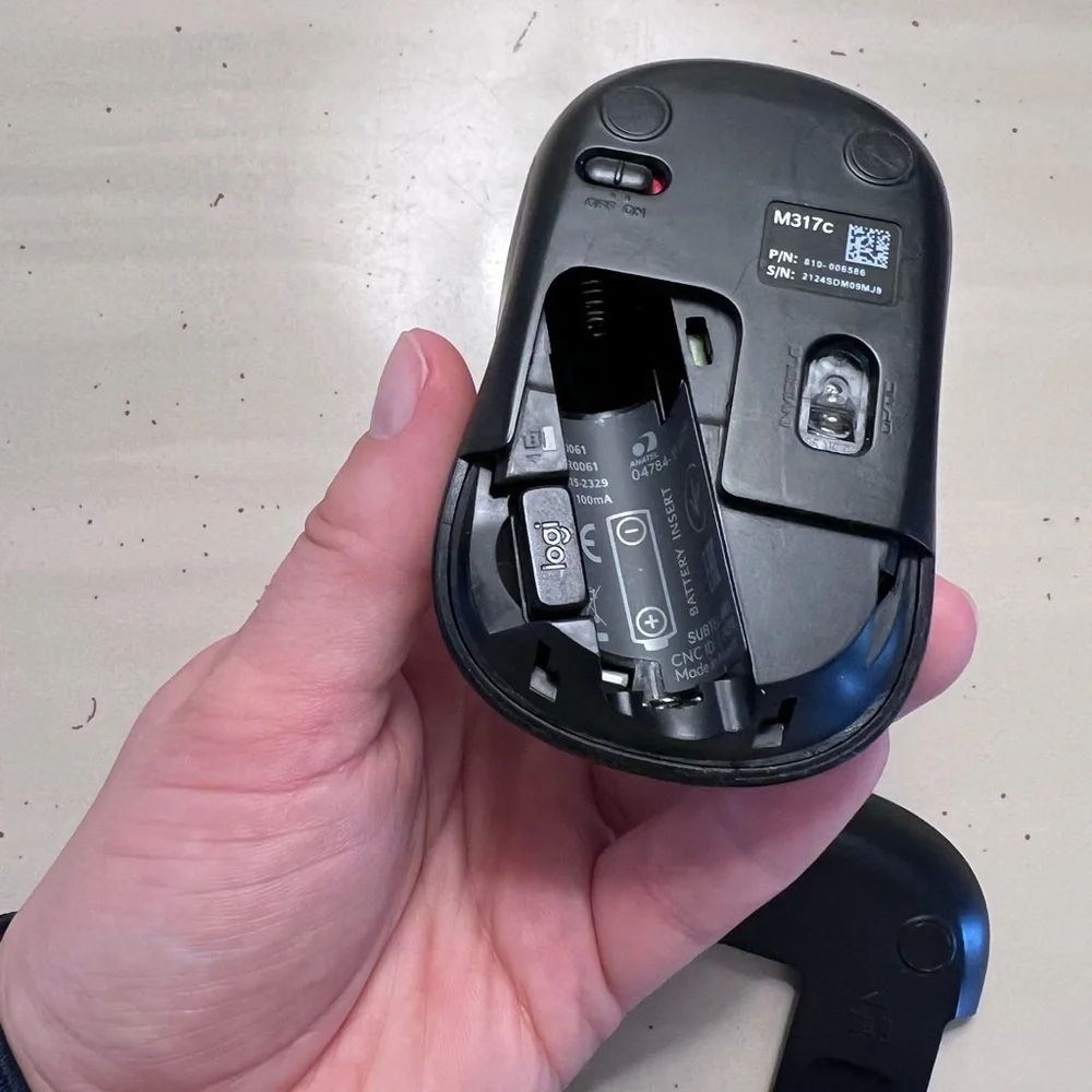 Logi wireless computer mouse with USB attachment
